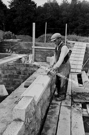 MOUNTNUGENT BUILDING OF MONASTERY  STONEMASON AT WORK   REV A D'HOINE CRP  WITH CLERK OF WORKS